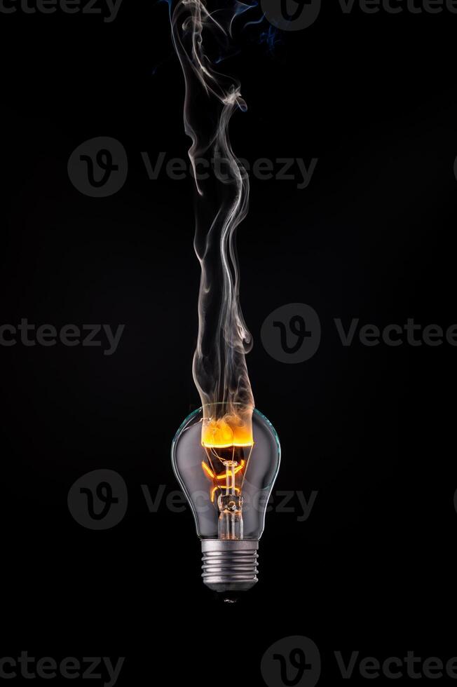 Illuminating creativity with a unique light bulb generating wisps of smoke dusk photo