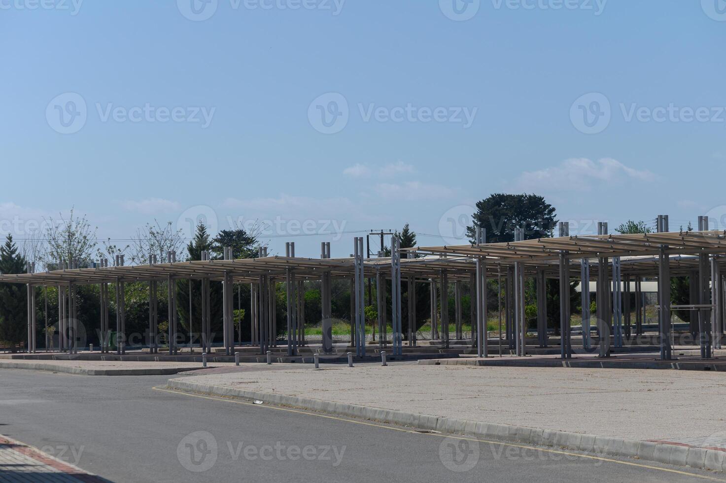 Constructed framework of a vibrant outdoor market awaits its lively transformation under a blue sky in a tranquil setting photo