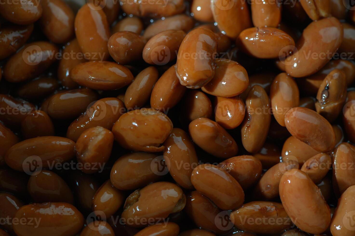 Bountiful display of shiny brown beans in a rustic bowl, highlighting the textures and colors of fresh produce in a sunlit kitchen photo