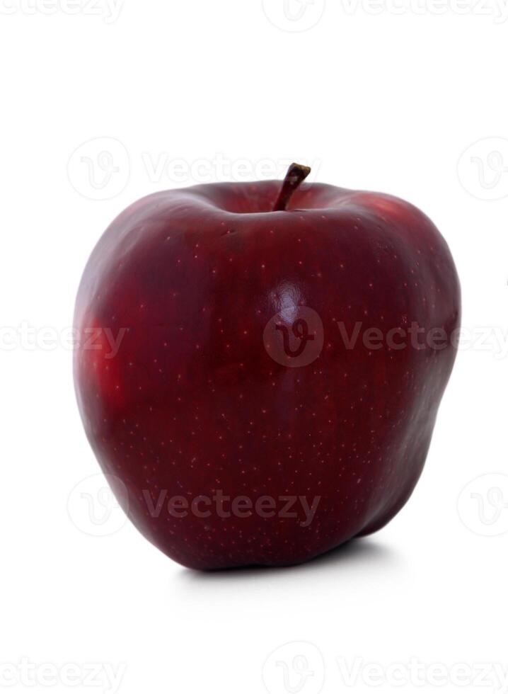 Vibrant red apple glistens under soft light, showcasing its smooth texture and rich color, inviting a sense of freshness and healthiness photo