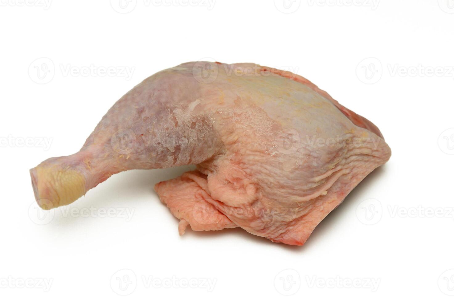 Raw chicken leg quarter ready for preparation in a modern kitchen setting featuring clean surfaces and vibrant lighting photo