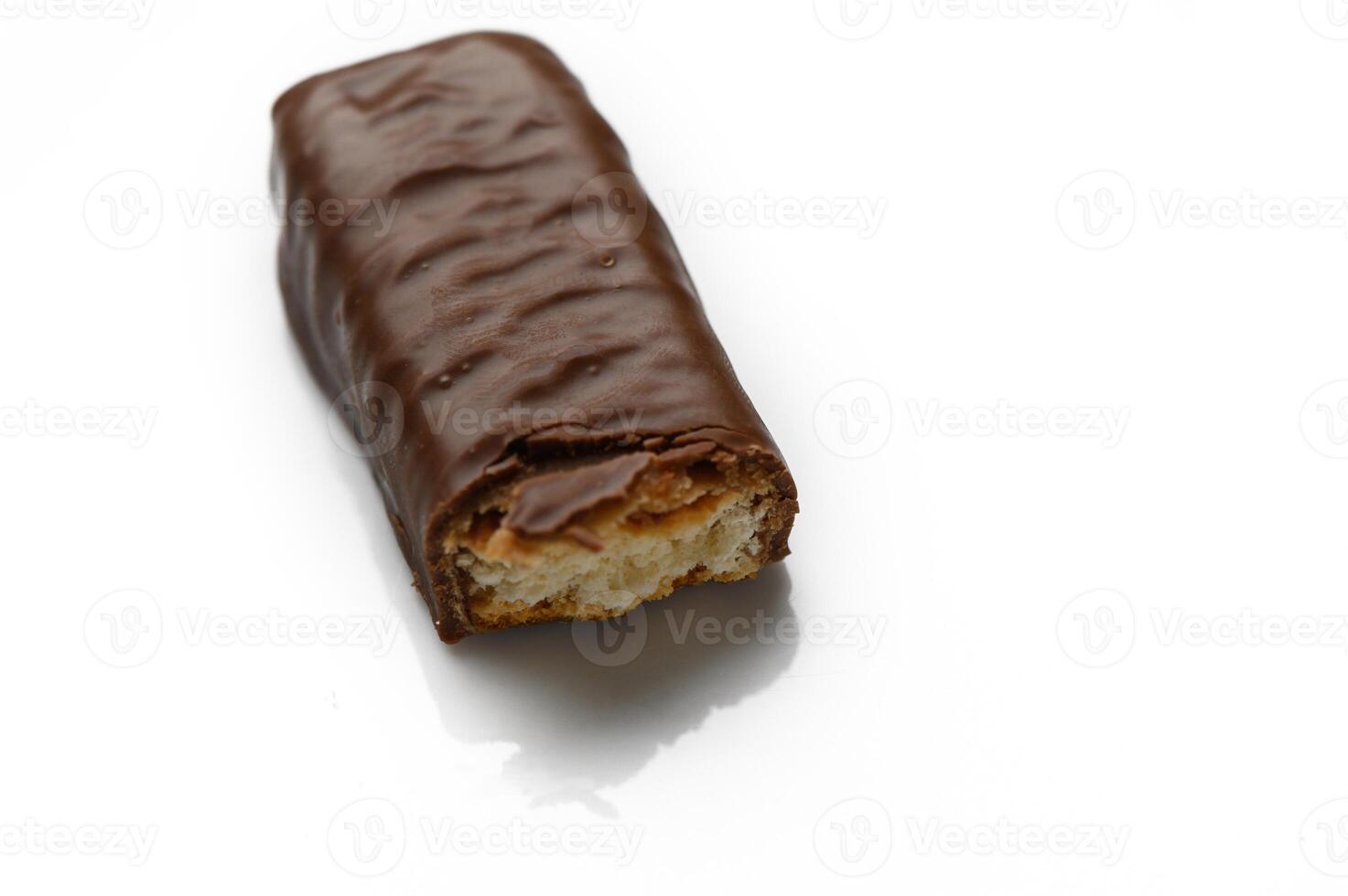 Indulgent chocolate treat lying temptingly on a reflective surface with a bite photo