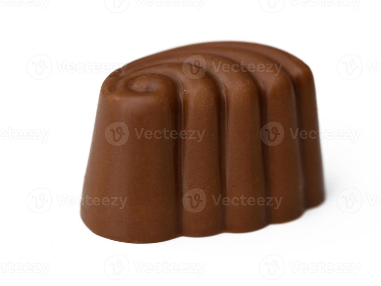 Delightful chocolate confection with a smooth curved design, expertly crafted for dessert lovers photo