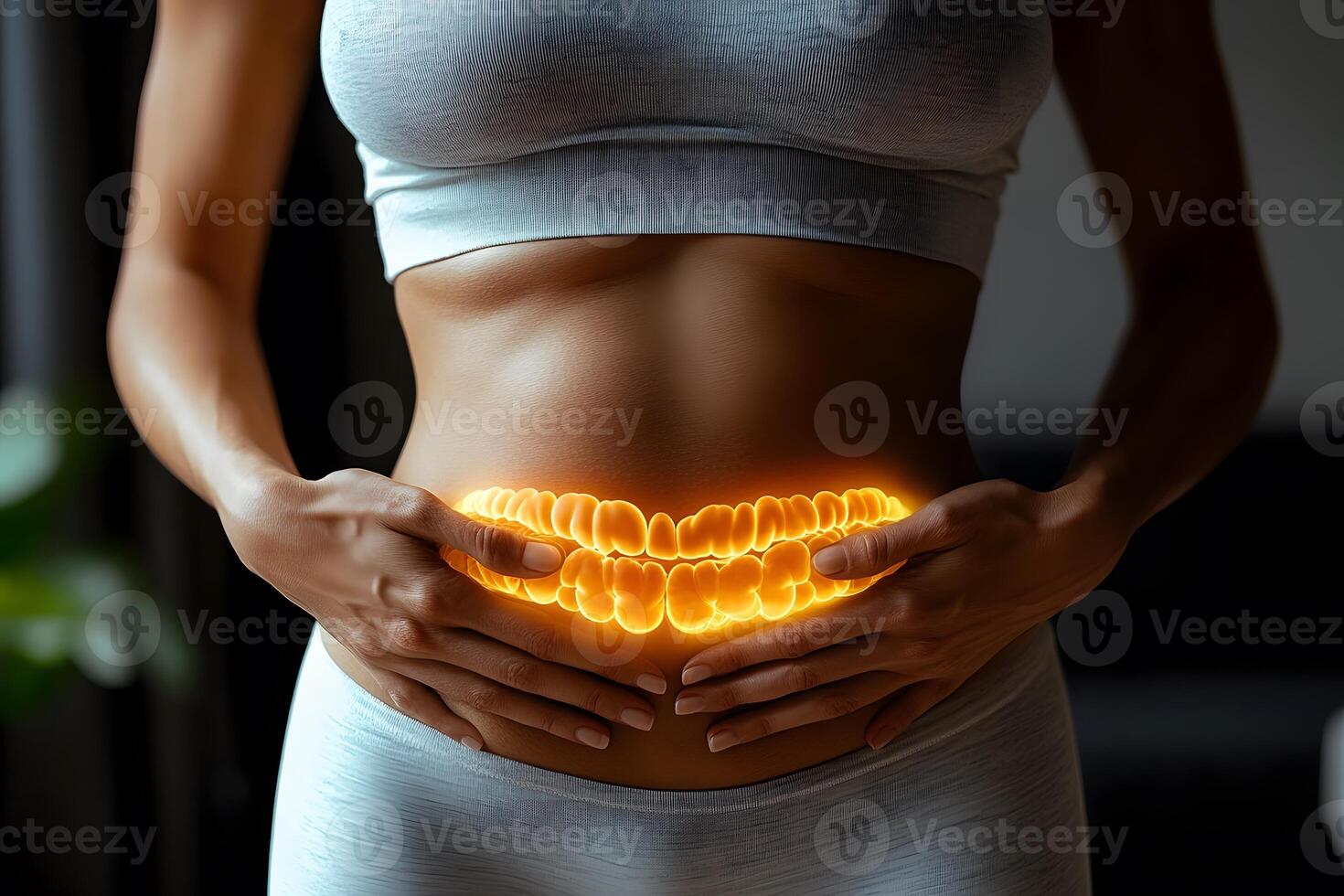 Digestive Health Concept with Glowing Intestines on Fit Woman in Sportswear photo