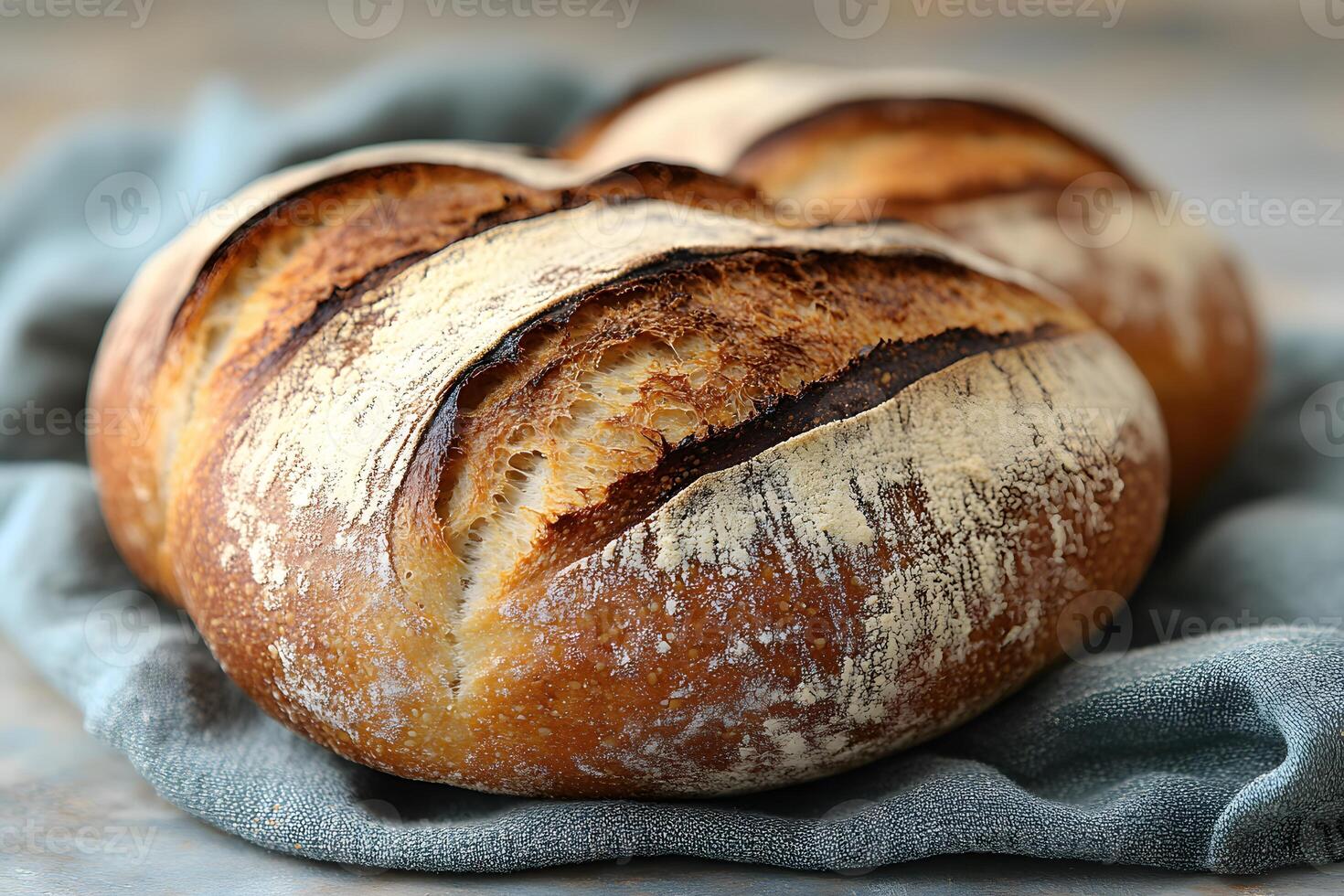 Rustic Artisan Sourdough Bread on Linen - Perfect for Culinary Designs and Food Photography photo