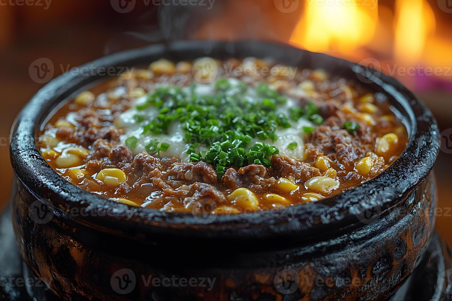 Savory Korean Soft Tofu Stew with Vegetables in Rustic Stone Bowl photo