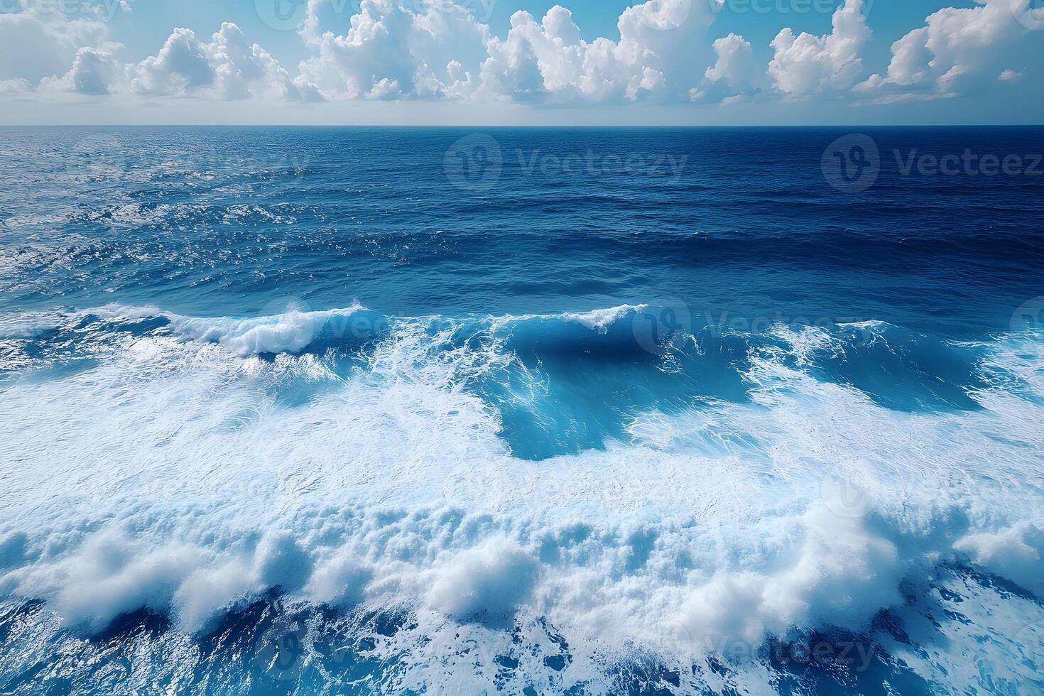 Serene Ocean Waves and Clouds Under a Clear Blue Sky - Ideal for Nature-Themed Prints and Posters photo