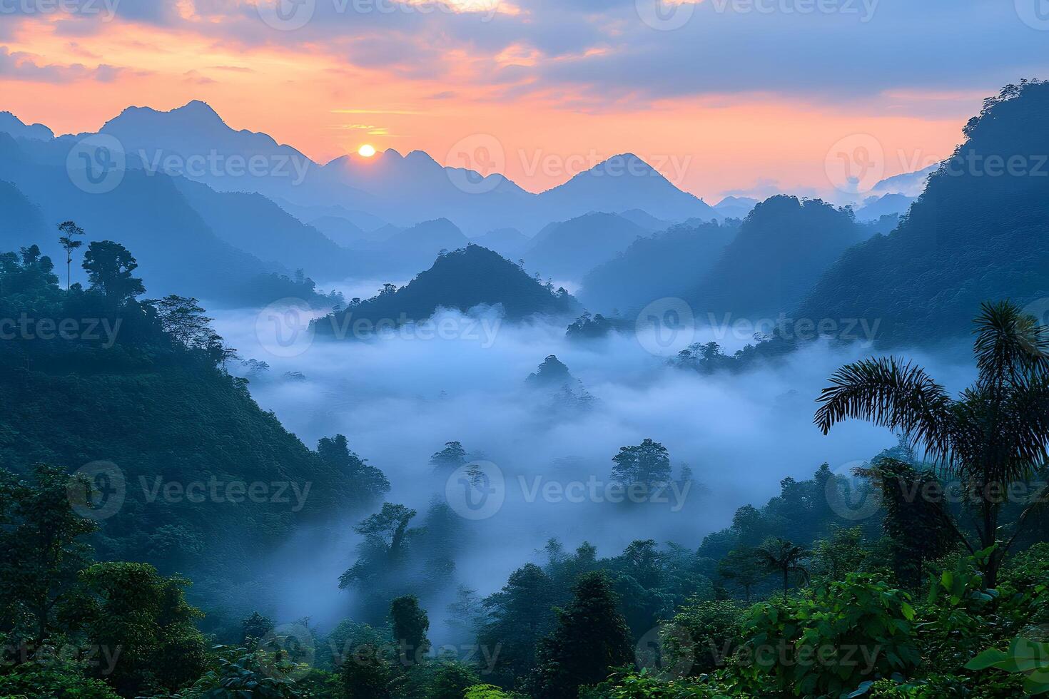 Serene Sunrise Over Misty Mountain Landscape with Lush Greenery photo