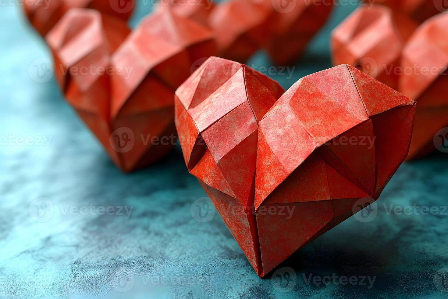 Geometric Origami Red Heart Art on Textured Blue Background for Valentine's Day Design photo