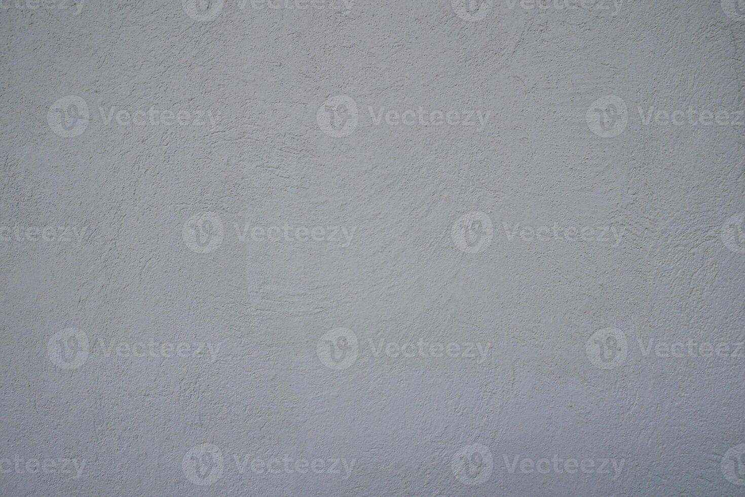 Textured gray wall with subtle nuances captured during early afternoon light photo