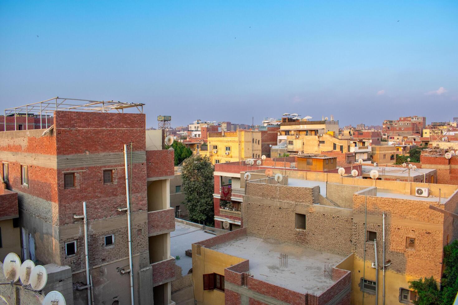 17.10.24 Giza, Egypt Building in slums in Egypt. Neighbourhood around Pyramids photo