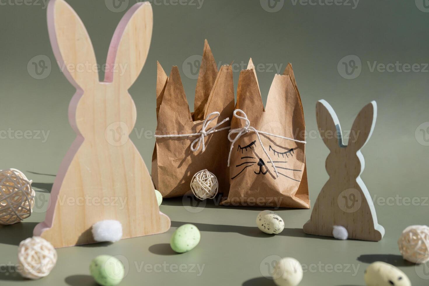 Homemade Easter gift bag rabbit bunny shaped sustainable materials decorations from craft paper. Creative craft handmade present for children. Easter celebration ideas. Spring holidays photo