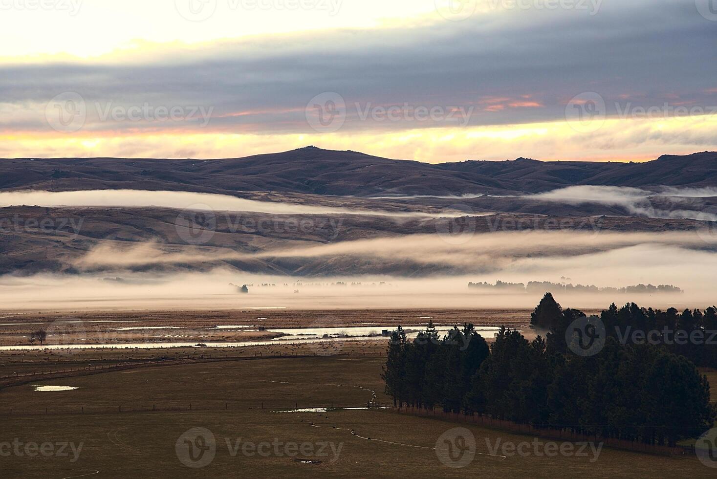view of the foggy mountains at the farm photo