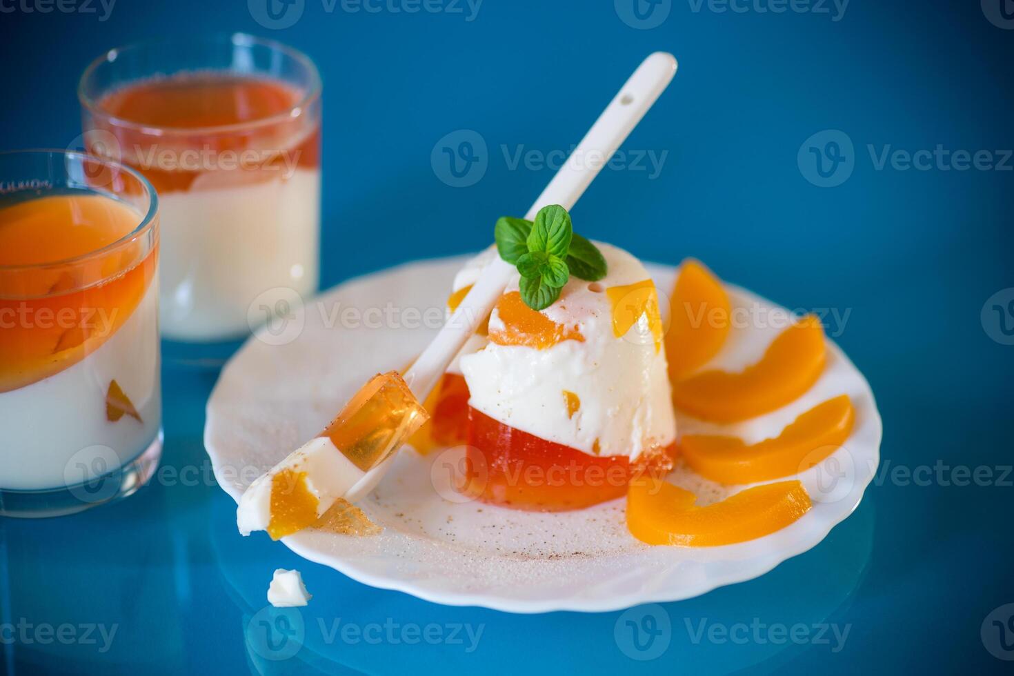 Jelly sweets.Portioned jelly dessert with yogurt cream and fruits photo