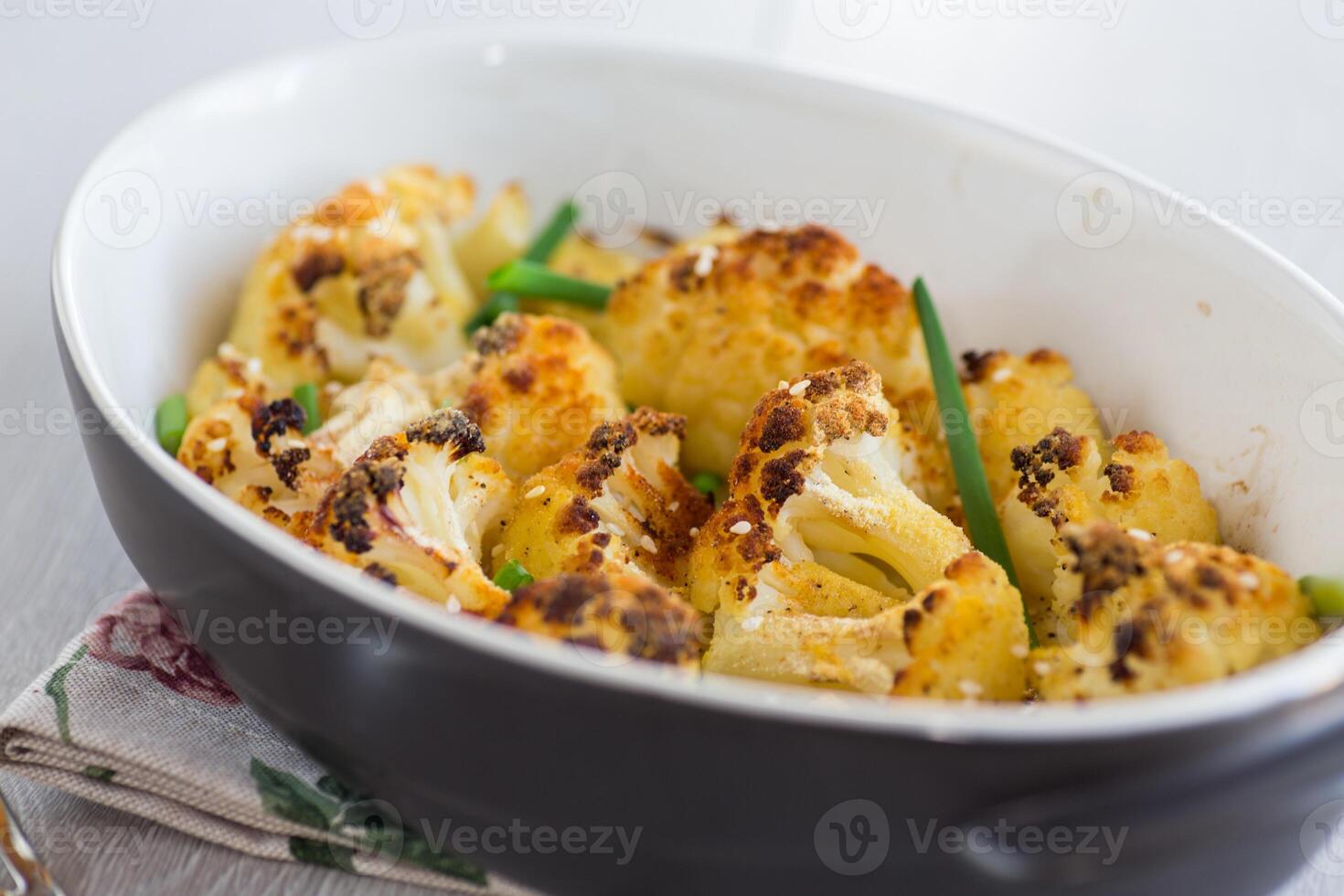 Simple dinner.Baked Cauliflower with Sesame and Herbs photo