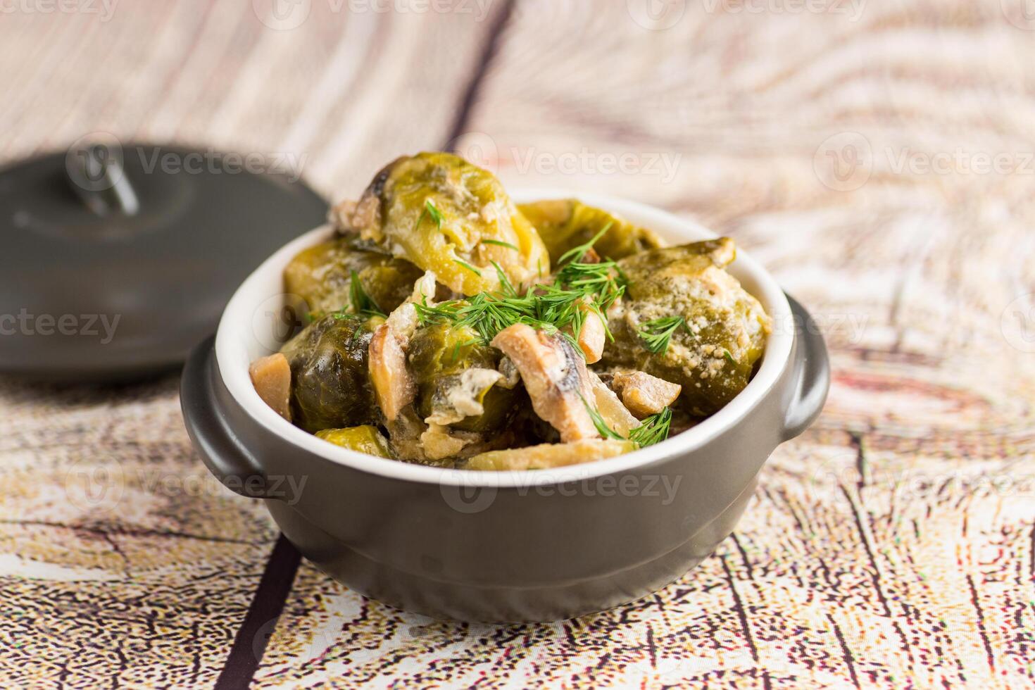 Simple dinner.Brussel sprouts stewed in sour cream sauce with mushrooms and spices photo