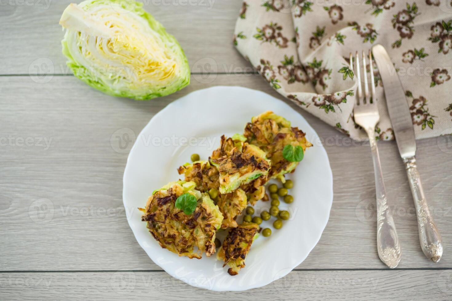 simple breakfast.vegetable cutlets from early cabbage with peas photo