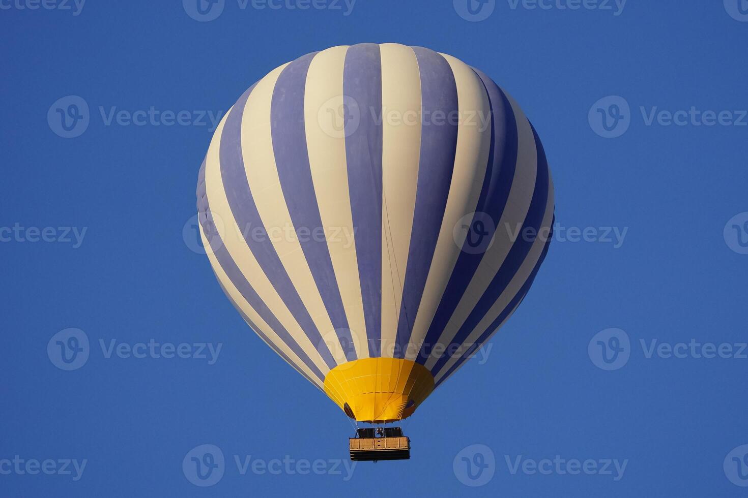 Blue and White Hot Air Balloon in Cappadocia, Nevsehir, Turkiye photo