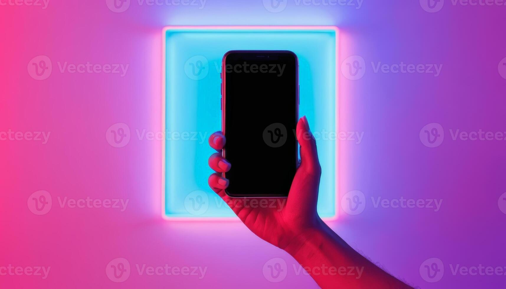 A hand holding a smartphone is illuminated by colorful lights, showcasing modern technology and digital connectivity in a vibrant setting. photo