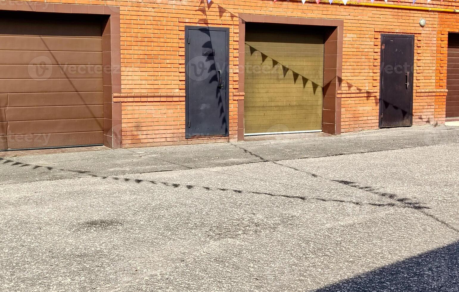 A street with a garage door and a sign photo
