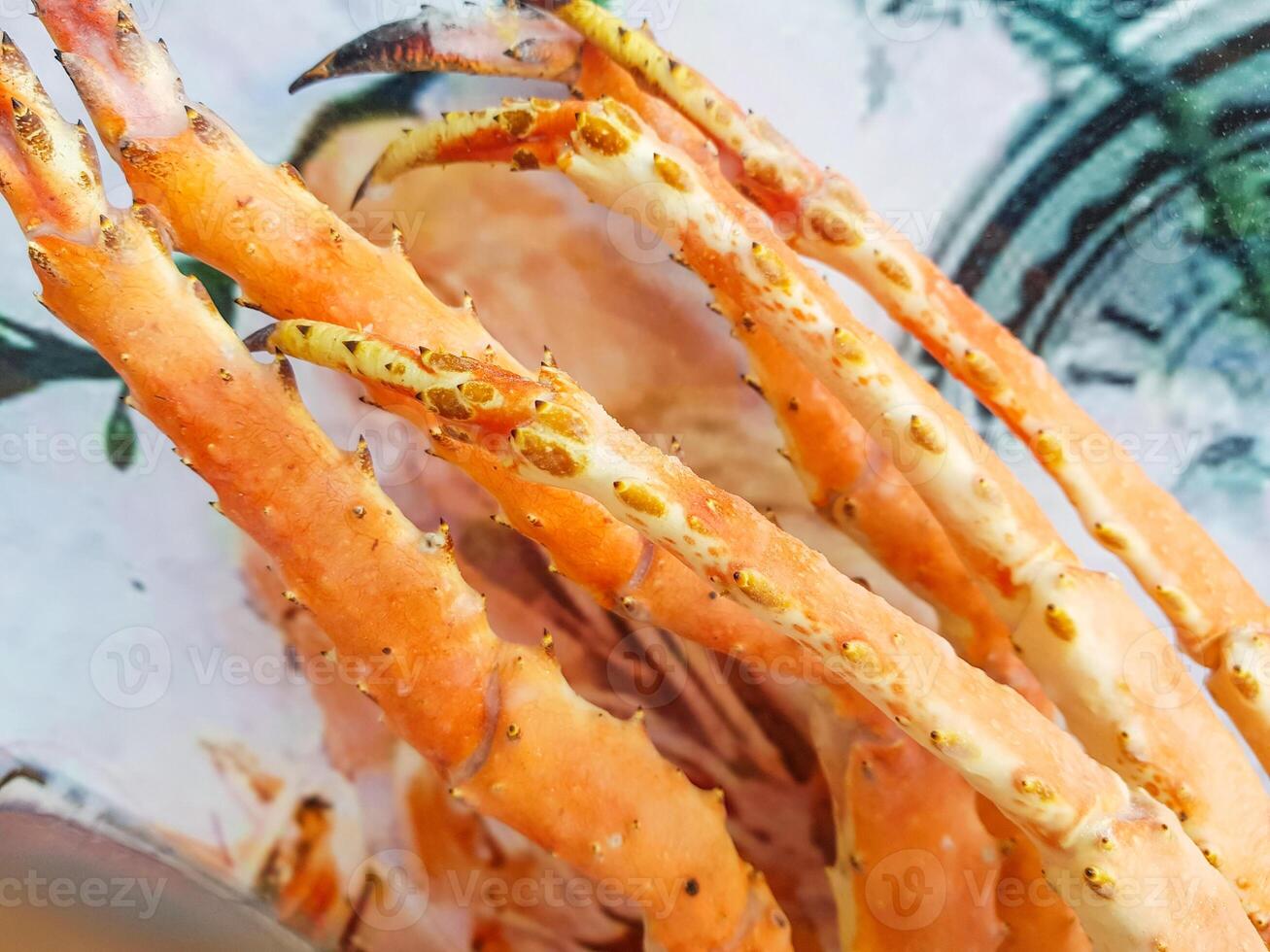 A close up of a plate with crab legs photo