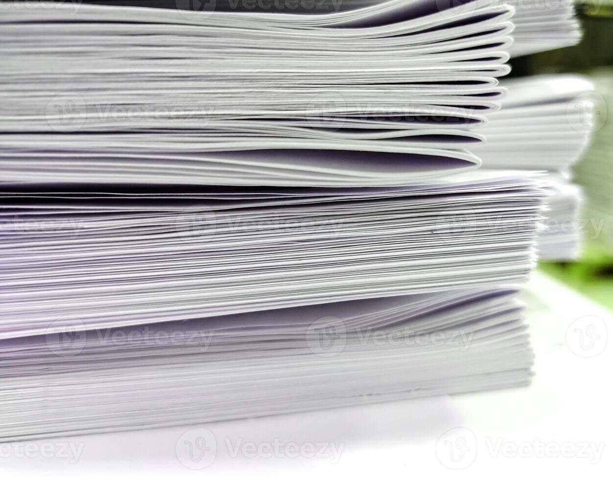 Close-up, a stack of glued book blocks prepared for binding in a printing house photo