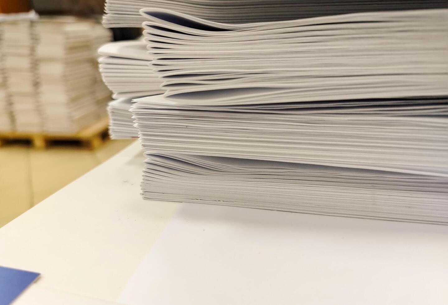 A stack of papers on a table photo
