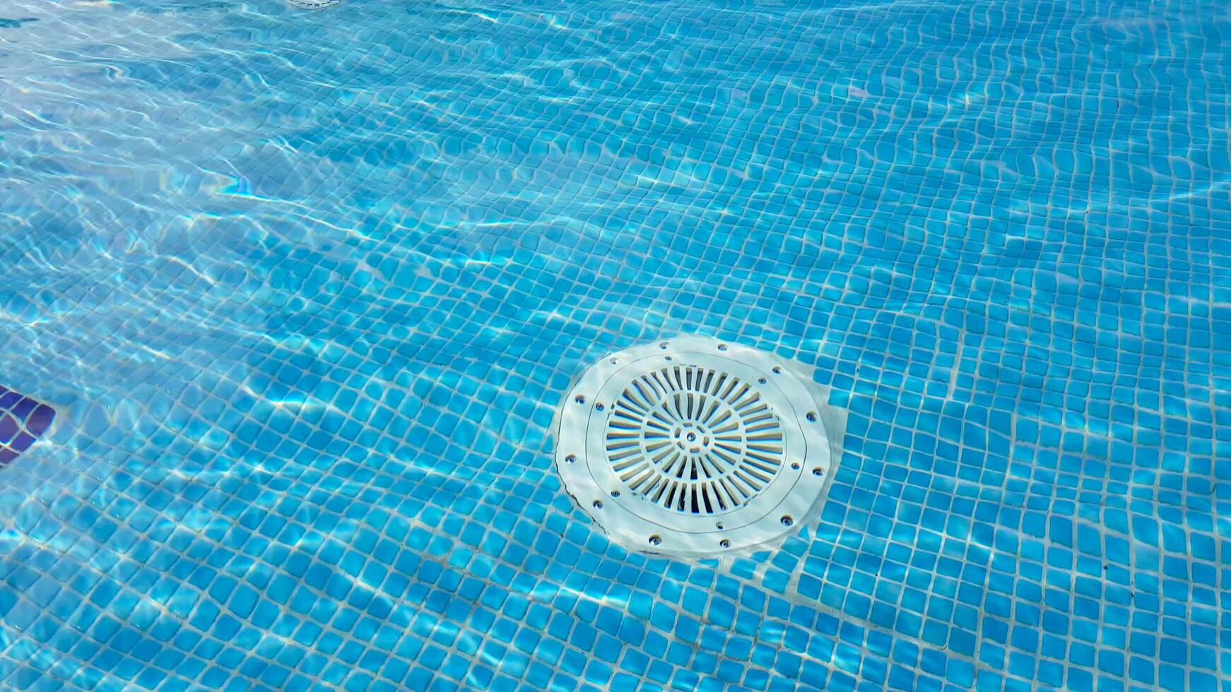 A swimming pool with a circular object in the middle photo