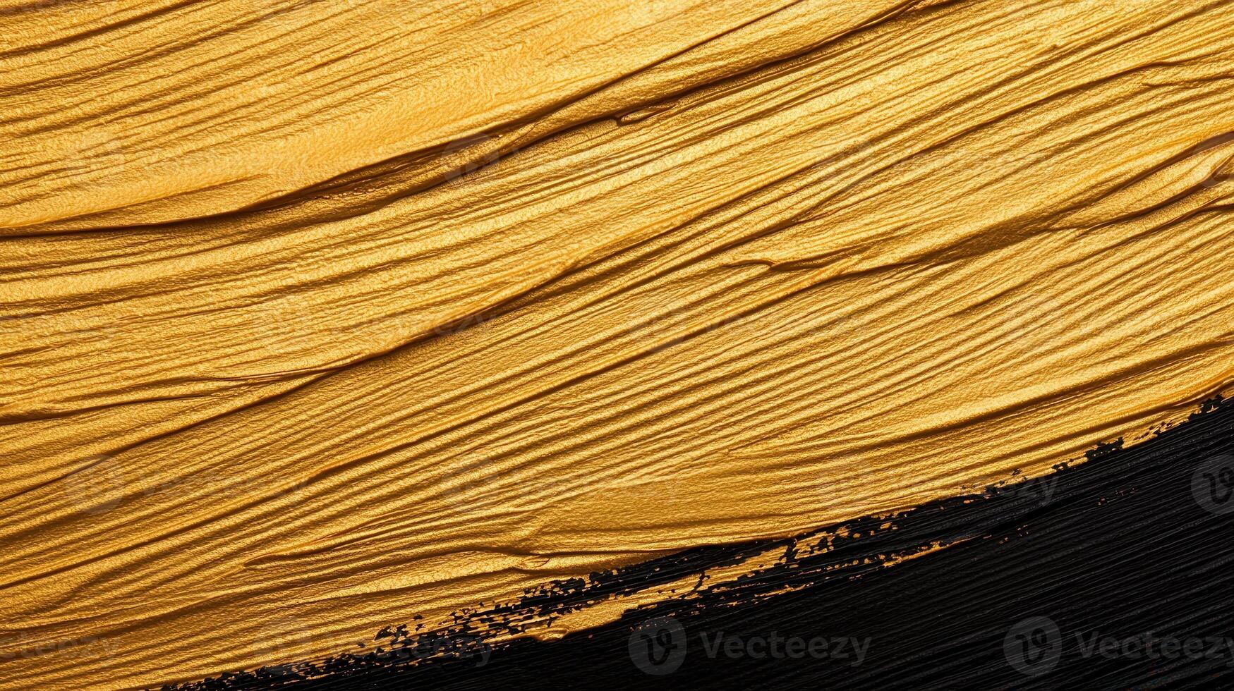 Golden paint brush stroke splashing across dark surface, representing artistic elegance and luxurious graphic design photo