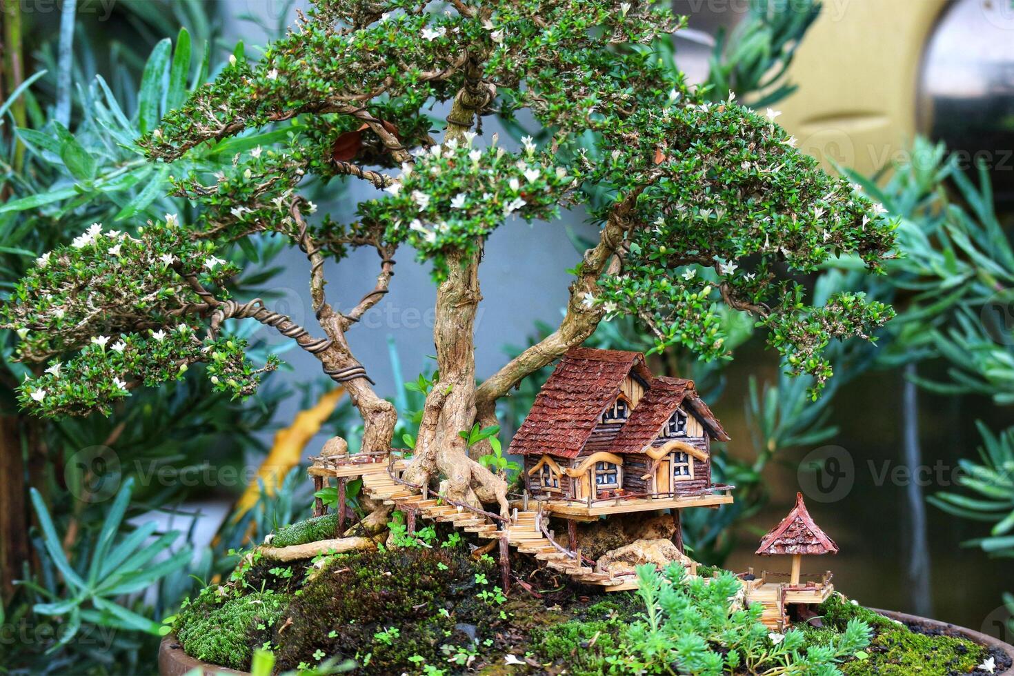Miniature Bonsai Treehouse A Whimsical, Serene Garden Scene photo