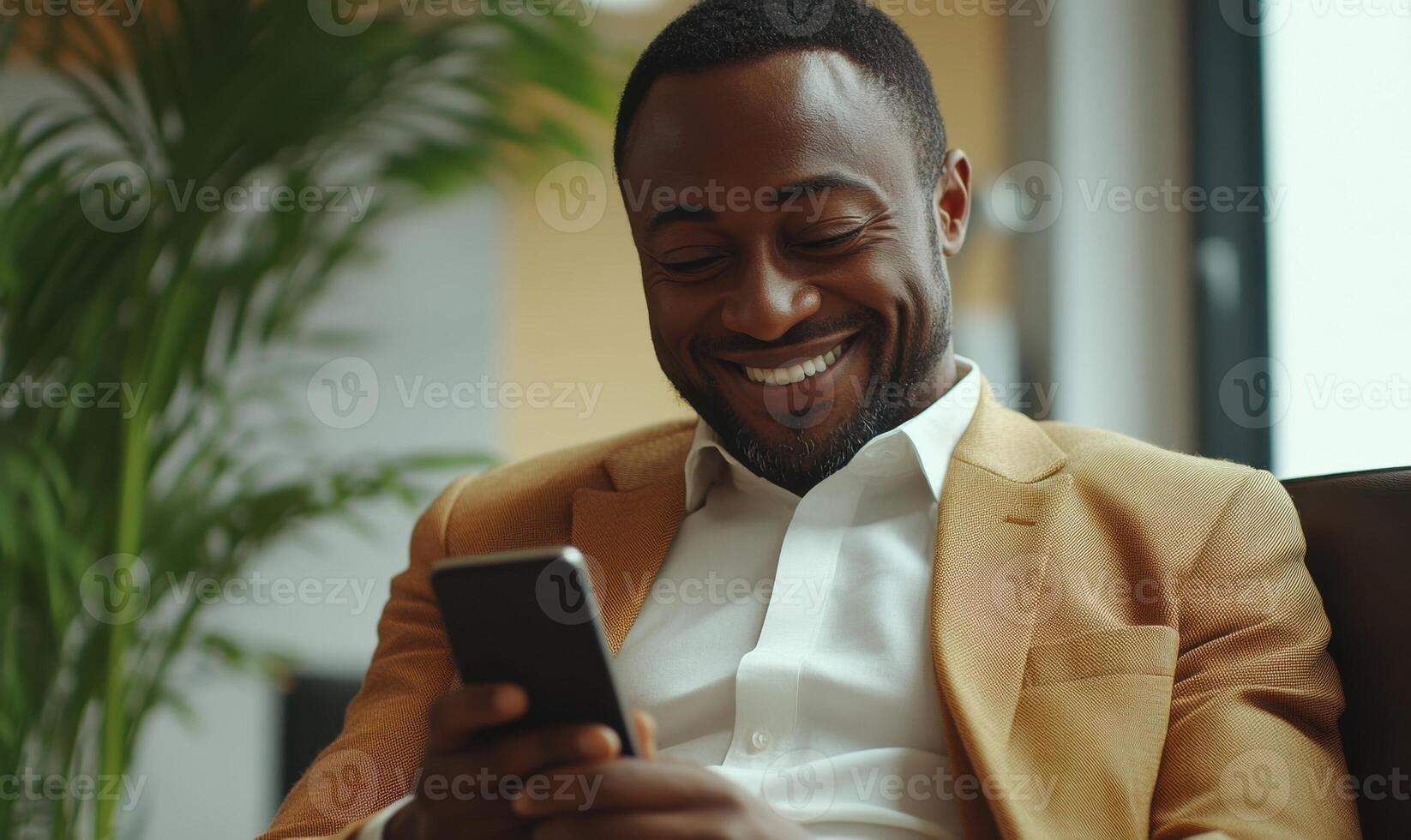 Happy mature while businessman reading good news on mobile phone and smiling in working manager modern office photo