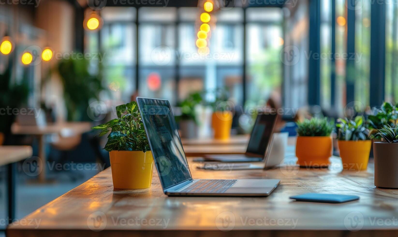 Empty with monitor displaying workplace Blank setting soft focused coworkers blurred, green plants framing minimalist workspace environment photo