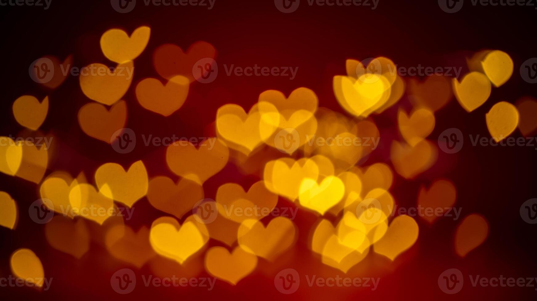 Vibrant heart-shaped bokeh lights create a dreamy, romantic atmosphere on a deep red background, perfect for valentine's day themes and love-inspired designs photo