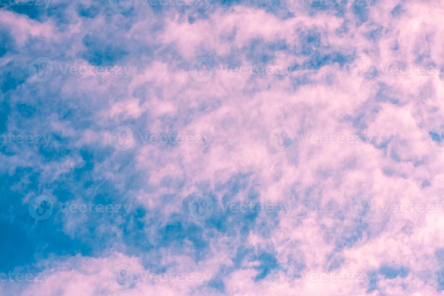 natural background, Pink clouds drifting across a vibrant blue sky create a dreamy, ethereal atmosphere, ideal for backgrounds and designs that evoke tranquility and beauty in nature photo
