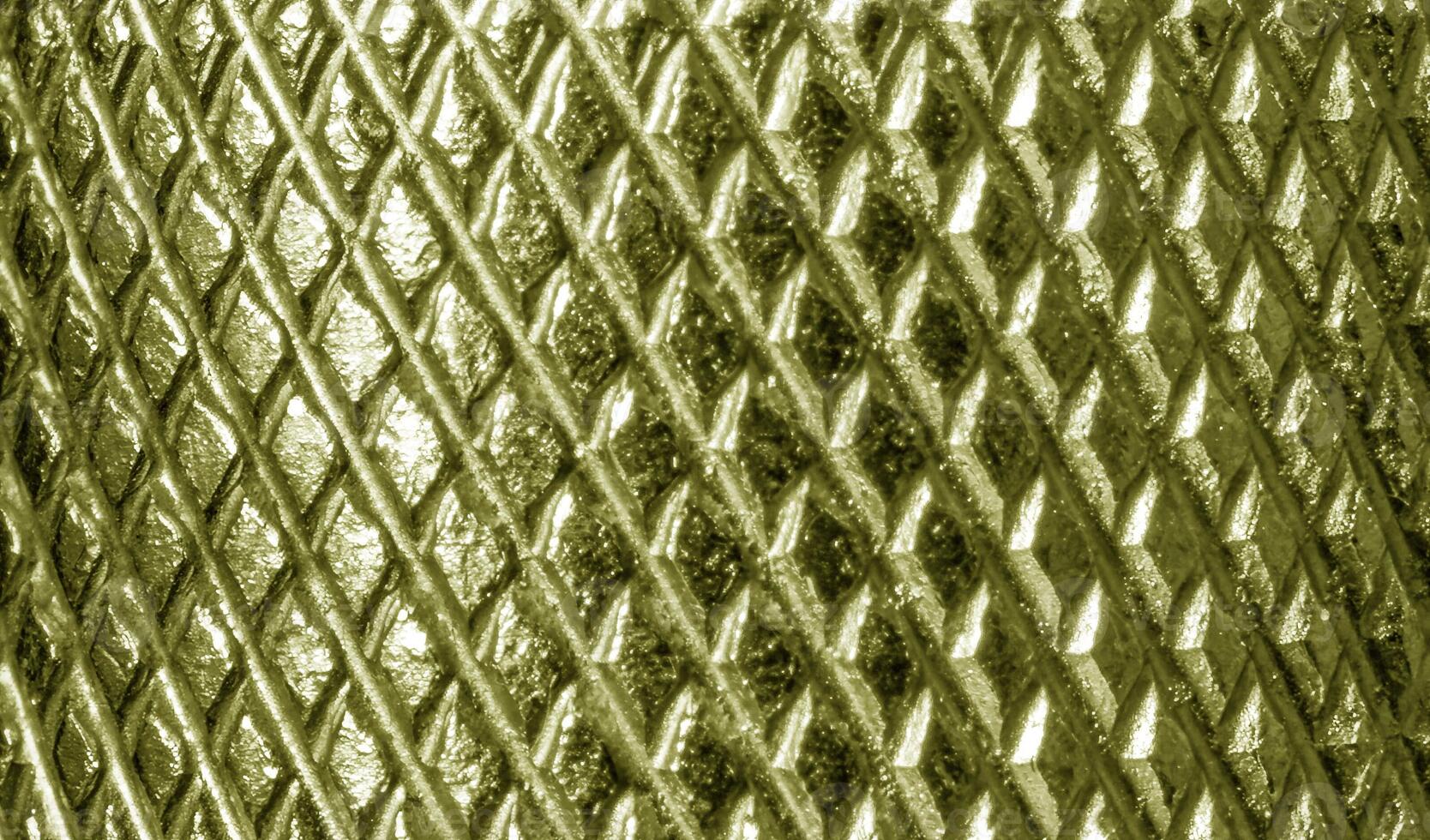 A close up of a metal mesh with a pattern photo