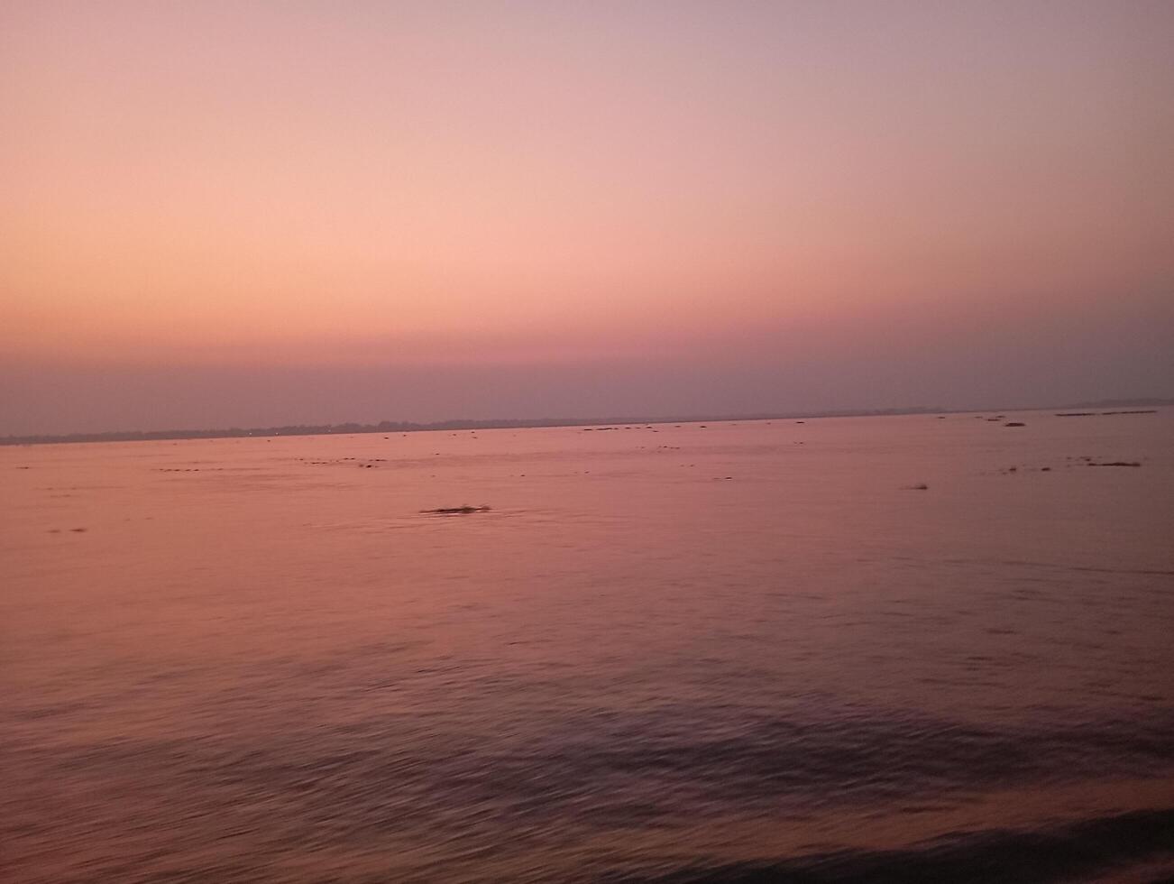 Sunset over the calm water, a beautiful scene photo