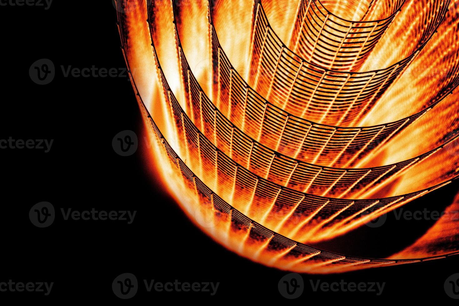 Abstract spiral with glowing red and orange tones and wire texture against a black background, symbolizing energy, motion, industrial and futuristic design concepts. Copy space 05 photo