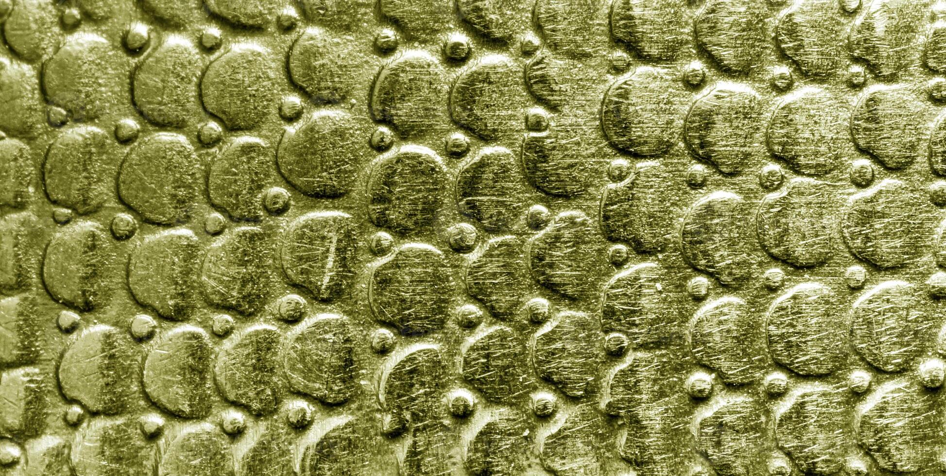 A close up of a gold snake skin texture photo