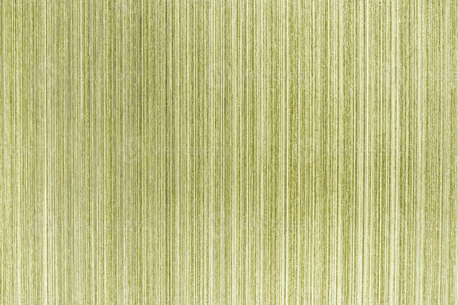 A green striped fabric background with a white background photo