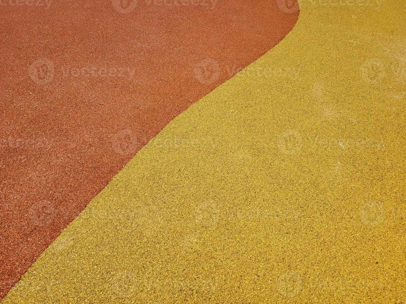Colorful background of the rubber coating of the outdoor sports ground photo