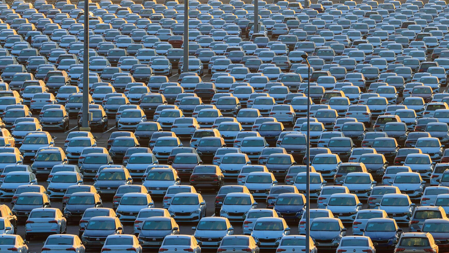Russia, Kaluga - January 11, 2022 - A lot of volkswagen automobiles ready for delivery and transportation to dealership lots. Concept for automotive industry and vehicle production. photo
