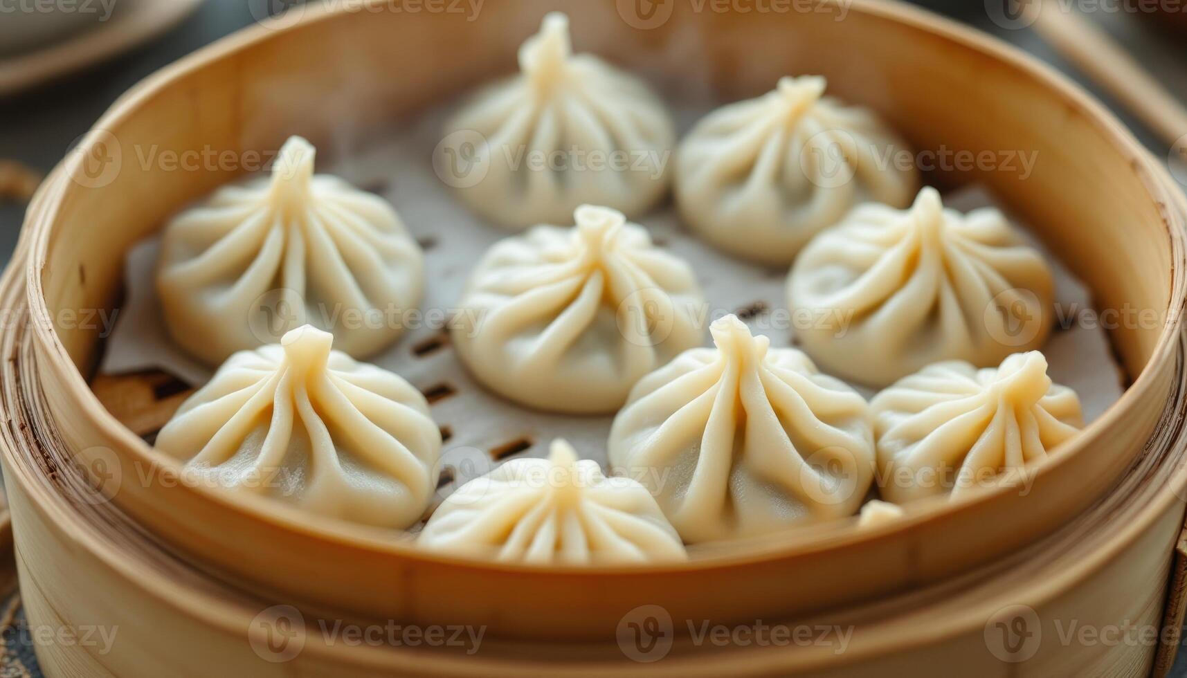 Steaming hot dumplings in a bamboo steamer ready to be served and enjoyed photo
