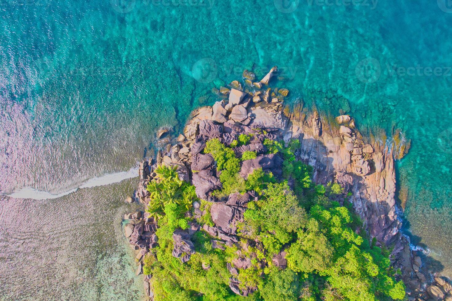 Drone shot of port glaud beach, small island nearby shot granite stones, white sandy beach and clear turquoise water, Mahe, Seychelles 5 photo