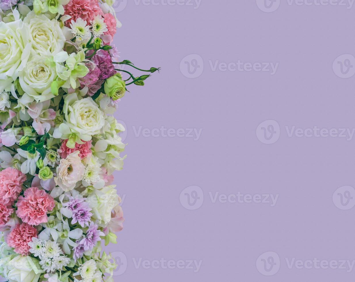 Beautiful bouquet flowers with different types of colorful flowers on violet color background photo