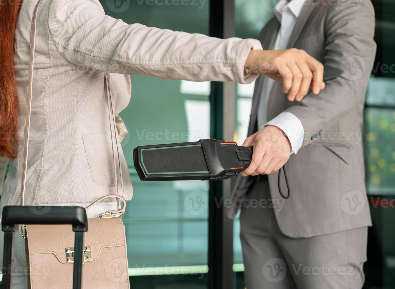Airport security male check at gates with metal detector and scanner photo