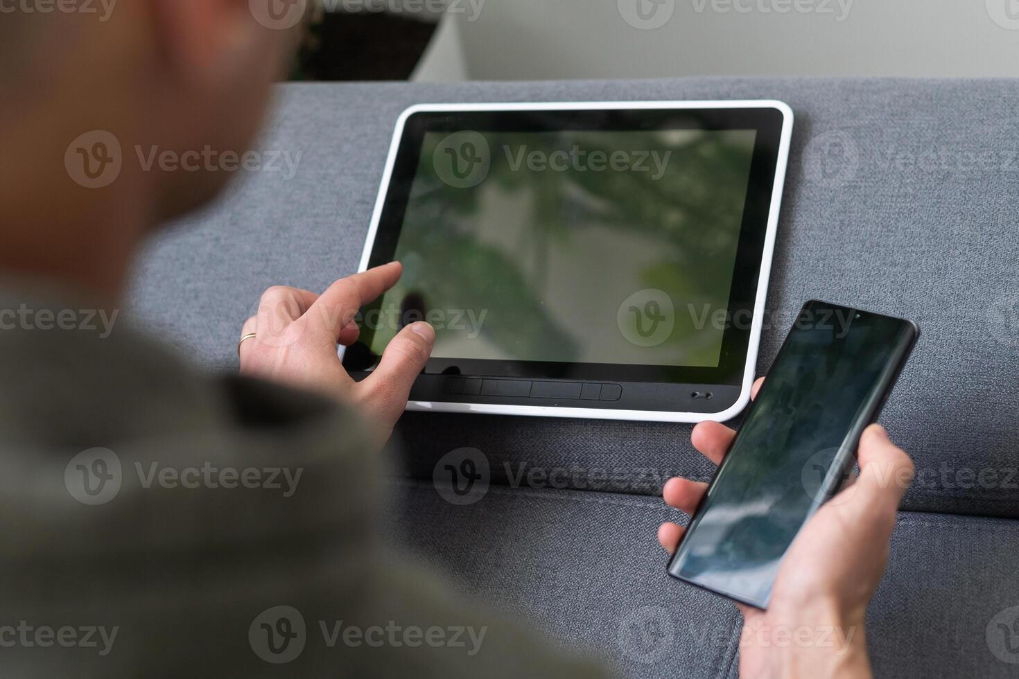 Digital tablet computer with isolated screen in male hands over cafe background photo