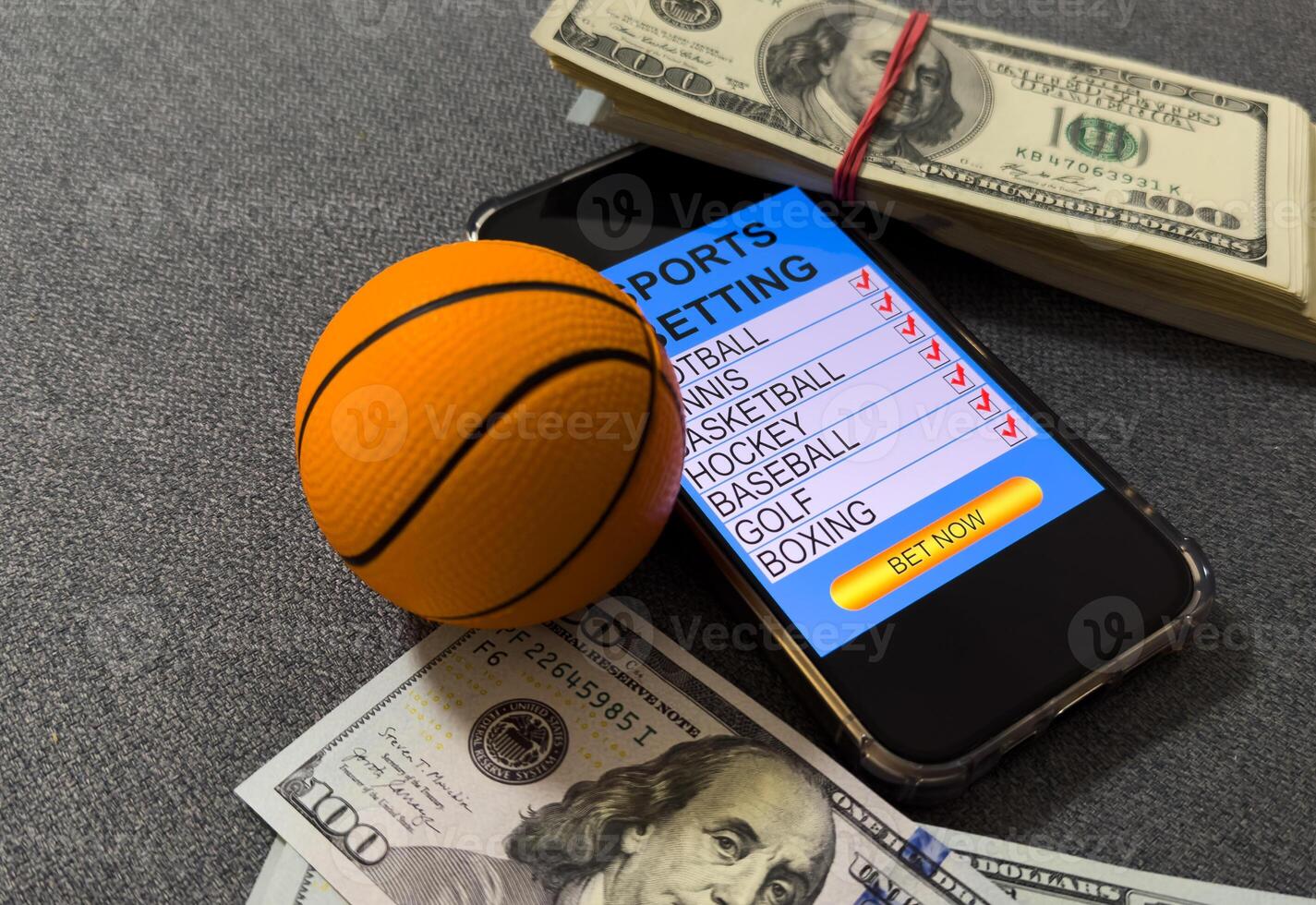 Analysis and online sports betting on mobile devices with application on a table with a green felt mat with objects representative of different sports. Top view. photo
