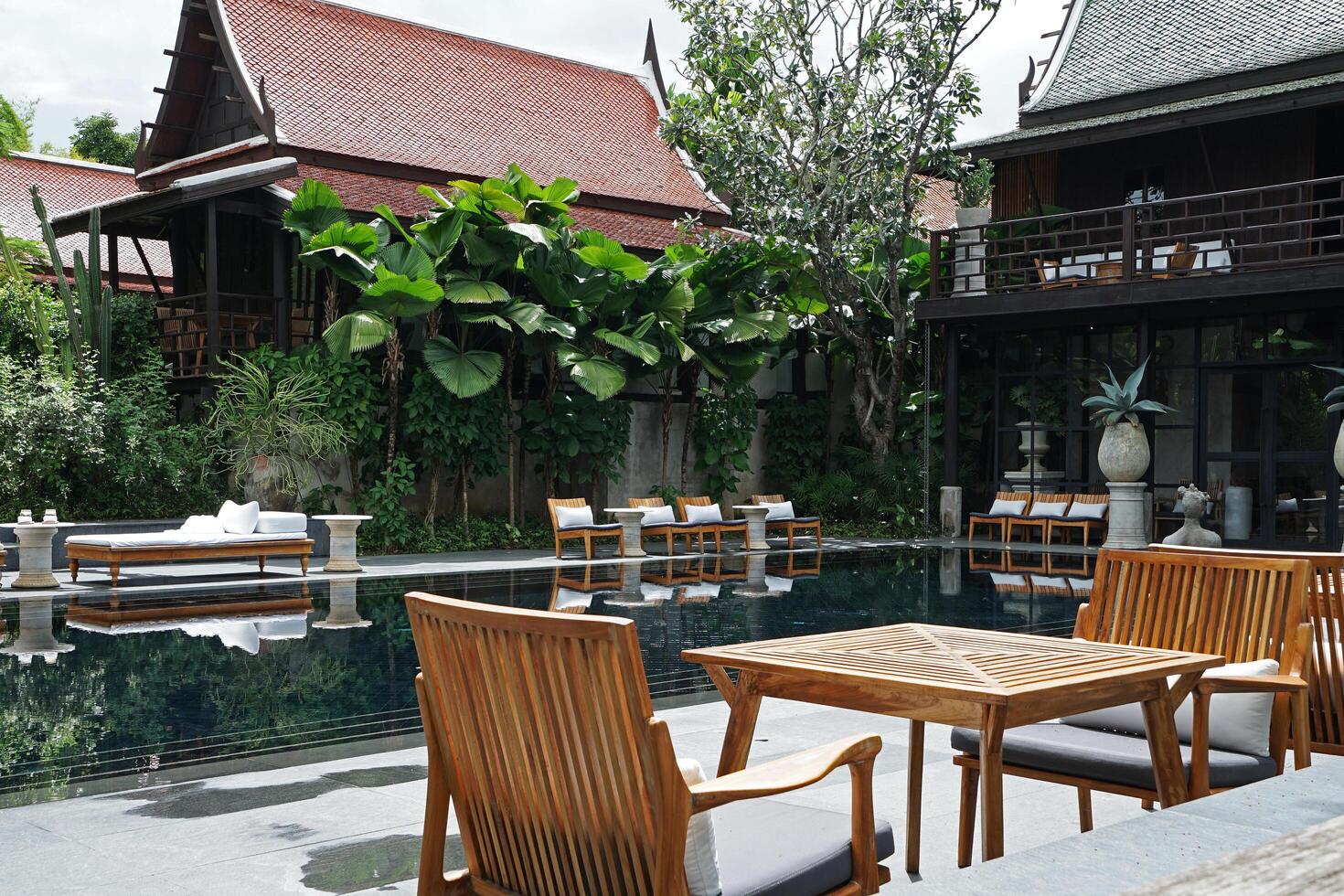 Exterior design and architecture of luxury resort and villa hotel with exotic swimming pool and patio garden photo