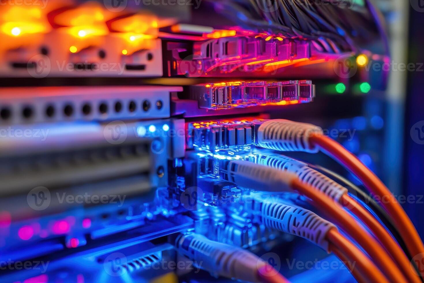 A close-up view of illuminated server components and network cables in a data center photo