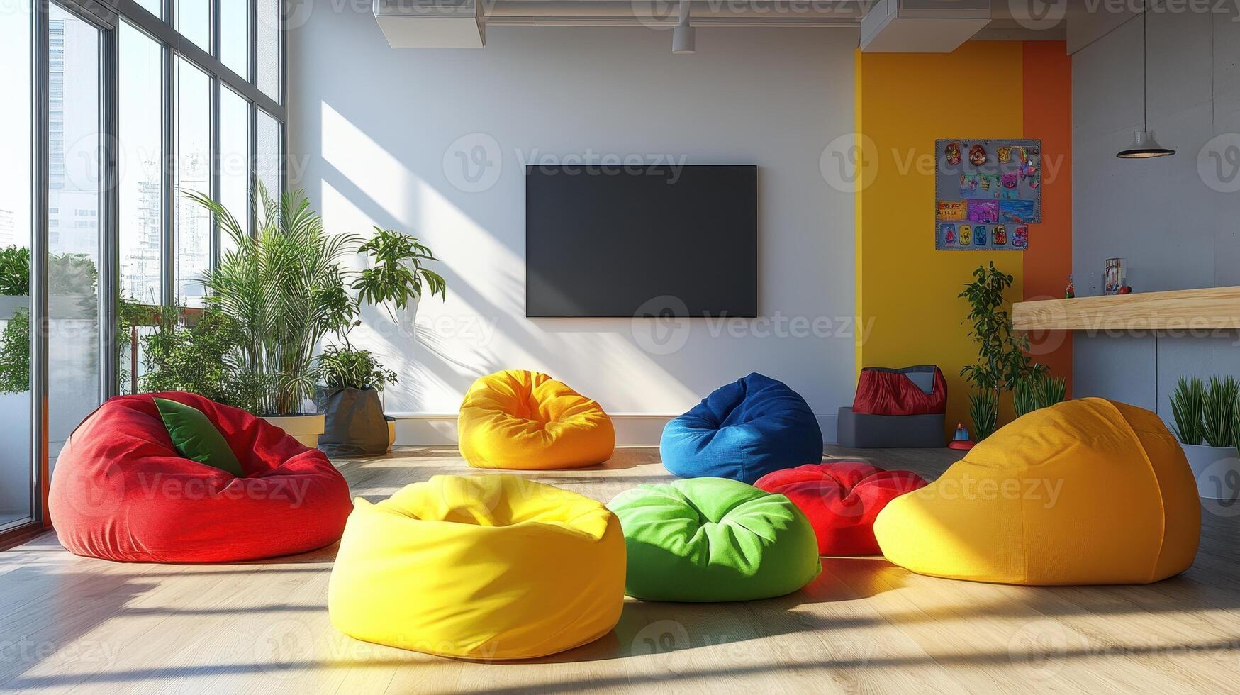 A vibrant lounge area with colorful bean bags and a TV, ideal for relaxation and socializing photo